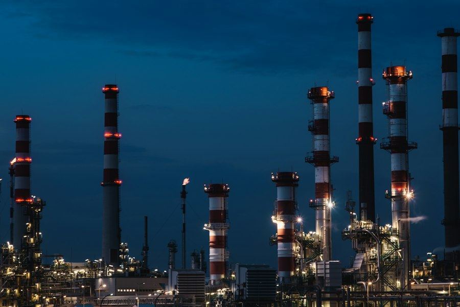 Oil and gas processing facility at night, where NARDO supports SCADA and automation projects